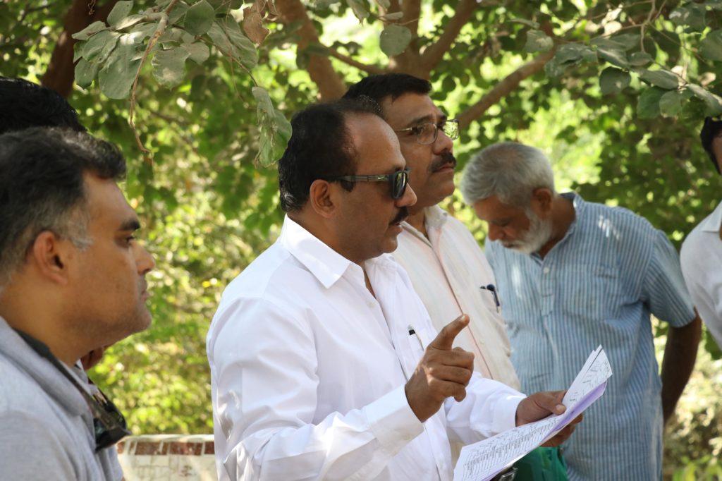 Dr. R.C. Devkar allocating team members.